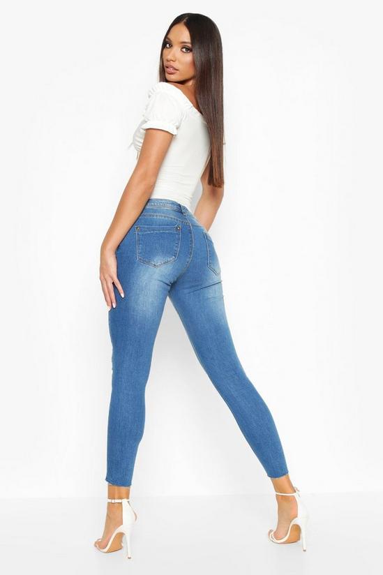 boohoo Mid Rise Distressed Knee And Ankle Skinny Jeans 2