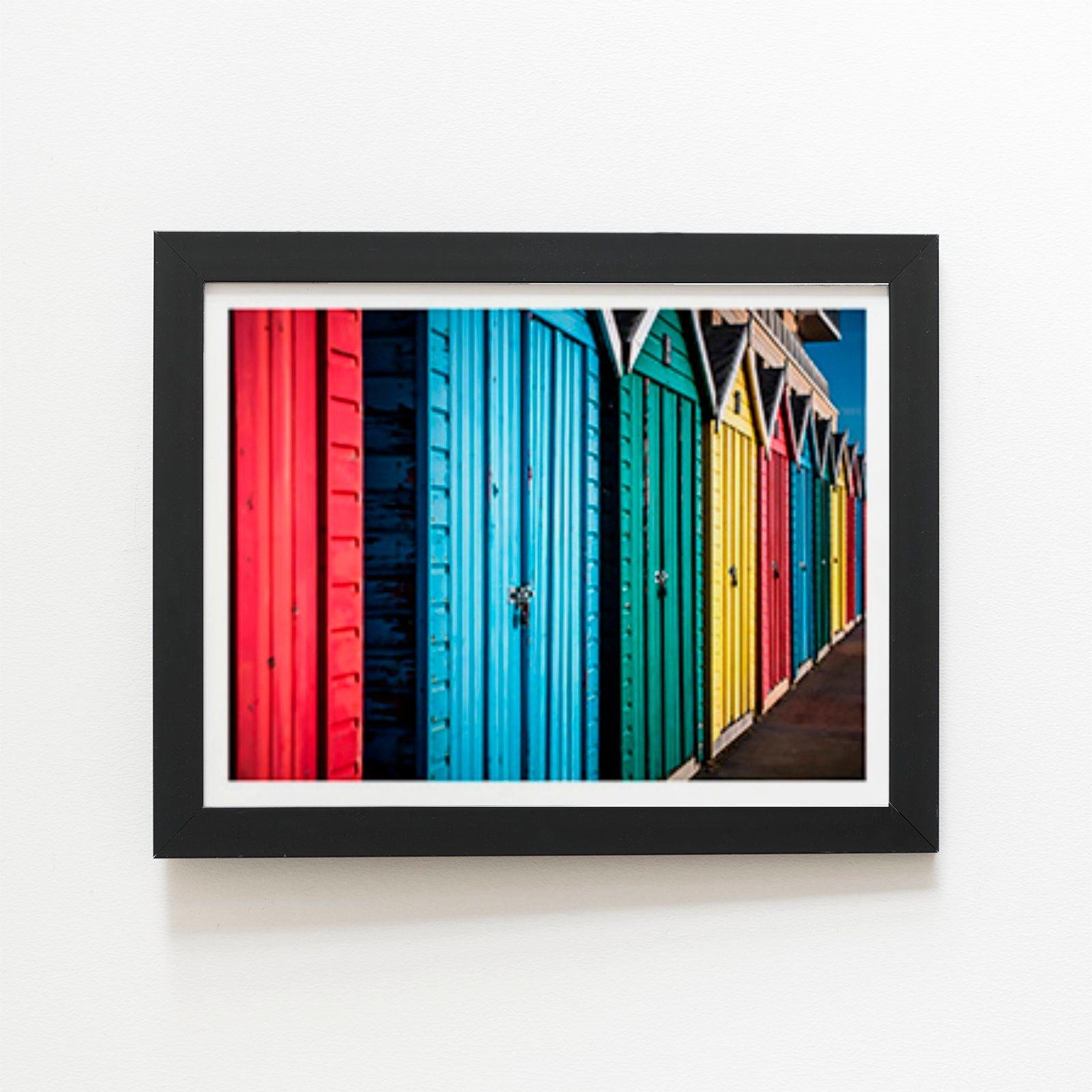 Coloured Beach Huts Framed Art Print